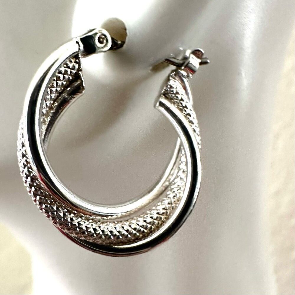 Silver tone small twisted hoop earrings